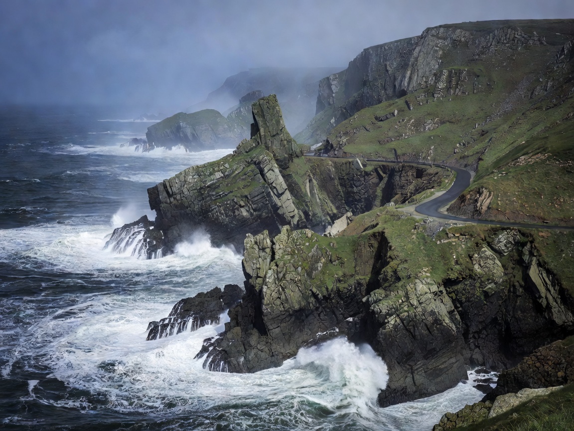 Wild Atlantic Way rugged coastal cliffs and ocean road in Ireland